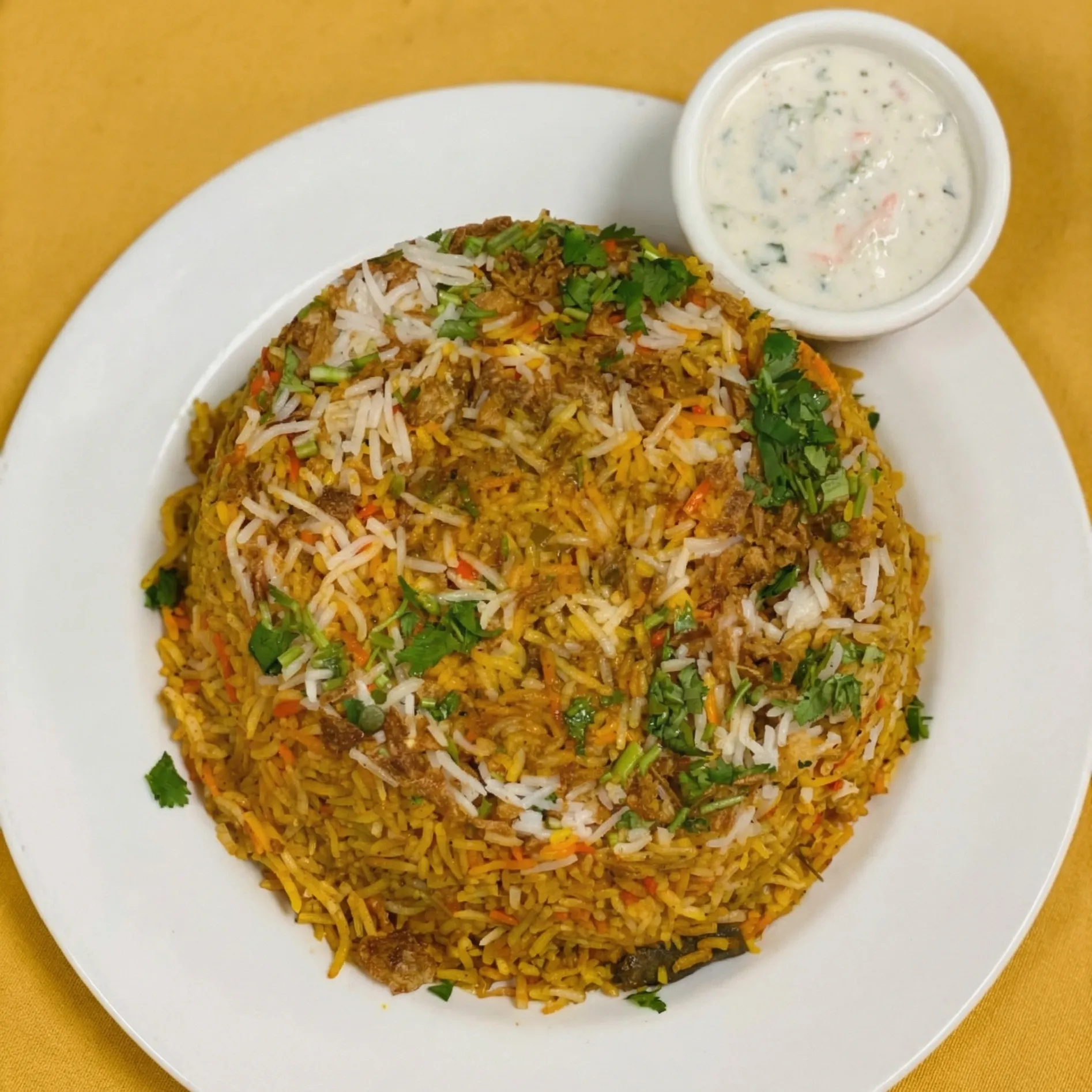 Goat Biryani - Traditional Indian rice dish at Green Chili Fine Indian Cuisine Calgary